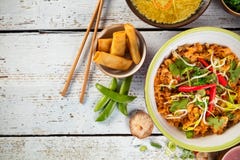 Asian Chicken Curry And Prawns With Rice And Sushi Pieces Stock Images Asian Chicken Curry And Prawns With Rice And Sushi Pieces Stock Images