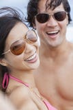 Asian Couple at Beach Taking Selfie Photograph Royalty Free Stock Photos Asian Couple at Beach Taking Selfie Photograph Royalty Free Stock Photos