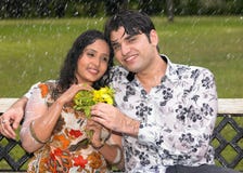 Asian Couple In The Rain Stock Photo