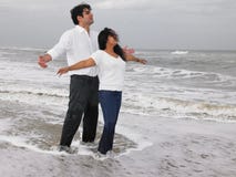 Asian Couple Standing In The Beach Stock Photos
