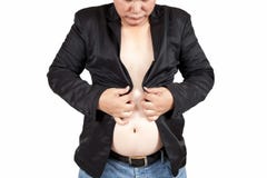 Asian fat man trying to button his suits., Difficult to close th royalty free stock photos Asian fat man trying to button his suits., Difficult to close th royalty free stock photos