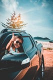 Asian girl smiling with perfect smile while sitting in the car. Royalty Free Stock Images Asian girl smiling with perfect smile while sitting in the car. Royalty Free Stock Images