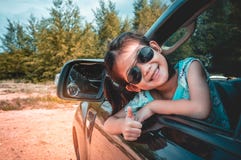 Asian girl smiling with perfect smile while sitting in the car. Stock Image Asian girl smiling with perfect smile while sitting in the car. Stock Image