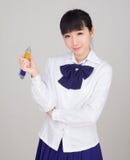 Asian girl student in school uniform studying with an oversize ball pen Royalty Free Stock Photo Asian girl student in school uniform studying with an oversize ball pen Royalty Free Stock Photo
