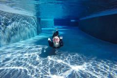 Asian girl in swimsuit,swimming under water stock photo Asian girl in swimsuit,swimming under water stock photo