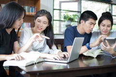 Asian Group of students sharing with the ideas for working on th royalty free stock photography Asian Group of students sharing with the ideas for working on th royalty free stock photography