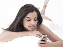 Asian Lady In Bed With Cell Phone Royalty Free Stock Image Asian Lady In Bed With Cell Phone Royalty Free Stock Image