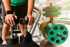 Asian man Bodybuilder with dumbbell weights power handsome athletic exercises.Metaphor Fitness and workout concept exercise Health stock images Asian man Bodybuilder with dumbbell weights power handsome athletic exercises.Metaphor Fitness and workout concept exercise Health stock images