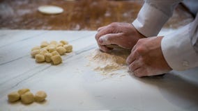 Asian man making fresh dumplings in a kitchen restaurant of Taiwan royalty free stock photo Asian man making fresh dumplings in a kitchen restaurant of Taiwan royalty free stock photo