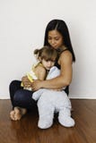 Asian Mother Cuddling Her 3-year-old Daughter Stock Image