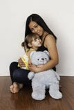 Asian Mother Cuddling Her 3-year-old Daughter Royalty Free Stock Images