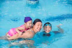 Mother and her children happy in swimming pool royalty free stock images Mother and her children happy in swimming pool royalty free stock images