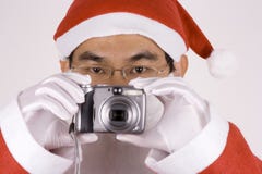 Asian Santa Claus With Camera Royalty Free Stock Images