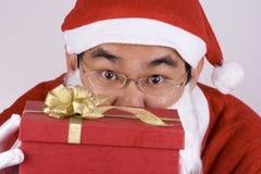 Asian Santa Claus With Present Stock Photo