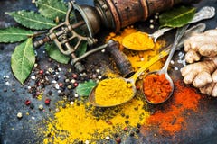 Asian spices dark table background Curry turmeric ginger bay lea Stock Images Asian spices dark table background Curry turmeric ginger bay lea Stock Images