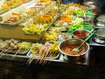 Asian Street Food. People Cooking, Selling And Buying Exotic Asian Food Royalty Free Stock Photography