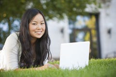 Asian Student Studying on Laptop Computer