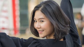 The asian teen girl with graduation gown cloth with feeling happy stock photography The asian teen girl with graduation gown cloth with feeling happy stock photography