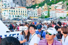 Asian tourists aboard making selfie with Amalfi town Tyrrhenian sea stock image Asian tourists aboard making selfie with Amalfi town Tyrrhenian sea stock image