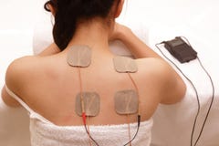 Asian woman is doing massage of electrical -stimulation stock images Asian woman is doing massage of electrical -stimulation stock images