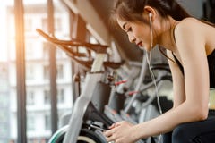 Asian Woman Exercising In The Gym Stock Image