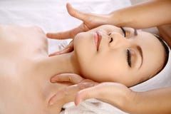 Asian Woman Get Facial Massage Stock Photos