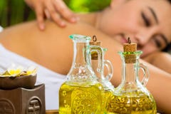 Asian woman having a massage in tropical setting Royalty Free Stock Images Asian woman having a massage in tropical setting Royalty Free Stock Images