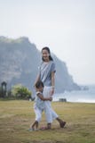 Asian woman and his daughter walking around park looking at came royalty free stock photo Asian woman and his daughter walking around park looking at came royalty free stock photo