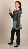 Asian Woman In Business Suit Holding Report Stock Photo