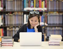 Asian Woman In Library With Laptop Stock Photo Asian Woman In Library With Laptop Stock Photo