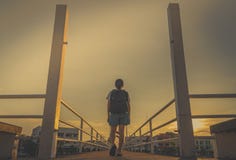 https://thumbs.dreamstime.com/t/asian-woman-tourist-walking-alone-backpack-bridge-city-evening-sunset-yellow-sky-walk-away-bad-thing-concept-117350379.jpg