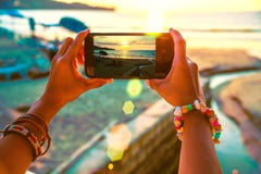 Asian Woman Travel Nature. Travel Relax. Use Cell Phone Take Pictures The Sunset On The Beach. In The Summer Stock Image Asian Woman Travel Nature. Travel Relax. Use Cell Phone Take Pictures The Sunset On The Beach. In The Summer Stock Image