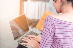 Asian woman using laptop computer working at home royalty free stock image Asian woman using laptop computer working at home royalty free stock image