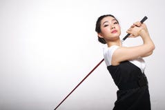 Asiatisches Frauengolf spielen stockfoto Asiatisches Frauengolf spielen stockfoto