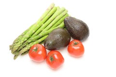 Asperge, avocado's en tomaten op een witte achtergrond stock fotografie Asperge, avocado's en tomaten op een witte achtergrond stock fotografie