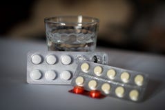 Pack of pills and glass of water. Aspirin and a Glass of Water royalty free stock photography Pack of pills and glass of water. Aspirin and a Glass of Water royalty free stock photography