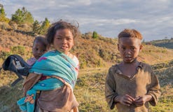 Children helping parents on farm in Madagascar