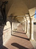 Assisi, Italy. The colonnade of the lower square of the Basilica and the Sacred Convent of Saint Francis royalty free stock photo Assisi, Italy. The colonnade of the lower square of the Basilica and the Sacred Convent of Saint Francis royalty free stock photo