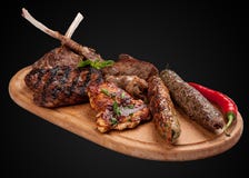 Assorted fried meat on a wooden board stock images Assorted fried meat on a wooden board stock images