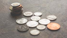 Assorted Silver-and-gold-colored Coins on Gray Surface Royalty Free Stock Photography Assorted Silver-and-gold-colored Coins on Gray Surface Royalty Free Stock Photography
