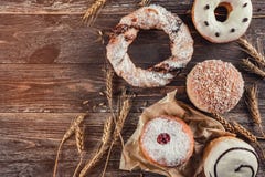 Assortment of different kind of cereal bakery: donuts and cracknel on old wooden background royalty free stock photo Assortment of different kind of cereal bakery: donuts and cracknel on old wooden background royalty free stock photo