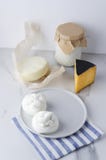 Assortment of different kinds of cheese:burrata,ricotta,gouda,provolone on marble table against white background.Vertical photo stock photo Assortment of different kinds of cheese:burrata,ricotta,gouda,provolone on marble table against white background.Vertical photo stock photo