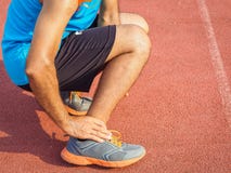 Athlete man has ankle injury, sprained leg during running training. healthcare and sport concept. stock photos Athlete man has ankle injury, sprained leg during running training. healthcare and sport concept. stock photos