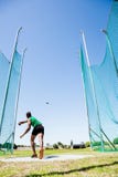 Athlete throwing discus in stadium royalty free stock photography Athlete throwing discus in stadium royalty free stock photography