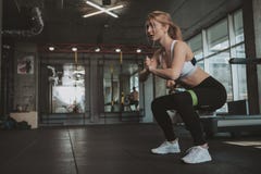 Beautiful young fitness woman working out at the gym stock photography Beautiful young fitness woman working out at the gym stock photography