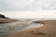 Atlantic Ocean. In the foreground, a stream flows into the sea stock images Atlantic Ocean. In the foreground, a stream flows into the sea stock images