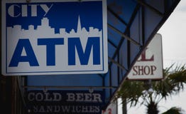 ATM sign hanging with art of San Francisco city royalty free stock image ATM sign hanging with art of San Francisco city royalty free stock image