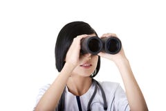 Atractive medical girl looking through binoculars royalty free stock photo Atractive medical girl looking through binoculars royalty free stock photo