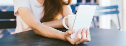 Attractive beautiful happy young Asian woman taking a selfie using a smart phone at cafe. Stock Image Attractive beautiful happy young Asian woman taking a selfie using a smart phone at cafe. Stock Image