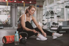 Beautiful young fitness woman working out at the gym stock image Beautiful young fitness woman working out at the gym stock image